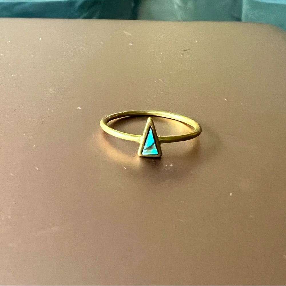 Gold ring with black opalescent stone